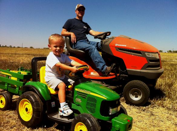 Ethan and Daddy riding tractors together!